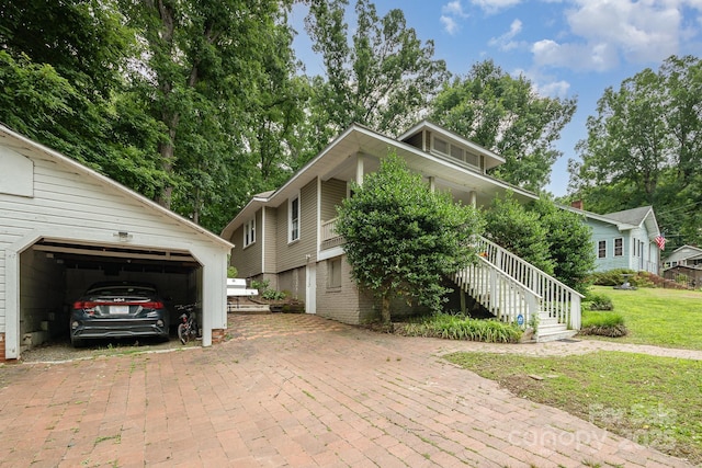 816 Fulton St, Albemarle, NC 28001 - view of home's exterior featuring a lawn, stairway, and covered porch