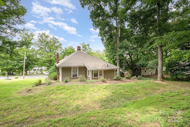 816 Fulton St, Albemarle, NC 28001 - view of front facade with a chimney and a front yard