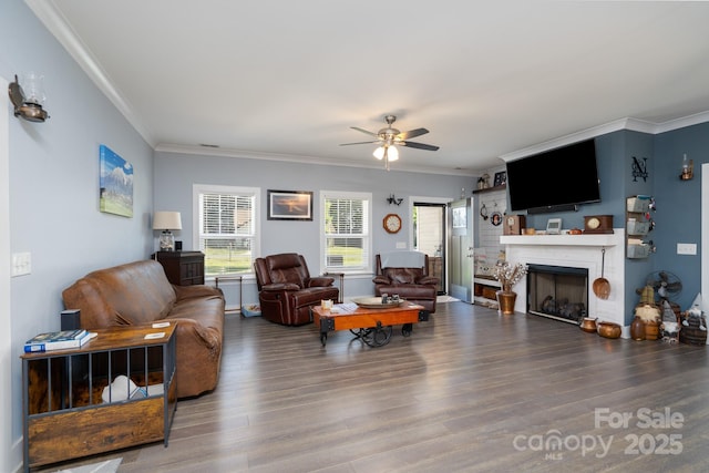 17438 Purser Dr, Locust, NC 28097 - living area featuring a ceiling fan, a fireplace, wood finished floors, and ornamental molding