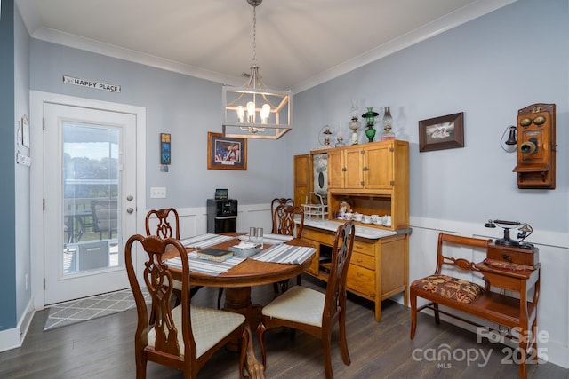 17438 Purser Dr, Locust, NC 28097 - dining space with dark wood-style flooring, a chandelier, and crown molding