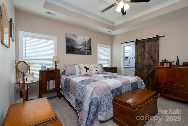 17438 Purser Dr, Locust, NC 28097 - carpeted bedroom featuring a barn door, ornamental molding, ceiling fan, and ensuite bath