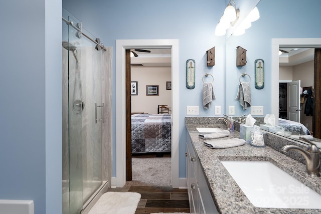 17438 Purser Dr, Locust, NC 28097 - full bathroom featuring ensuite bathroom, a shower stall, double vanity, and wood finished floors