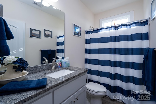 17438 Purser Dr, Locust, NC 28097 - bathroom with vanity, wood finished floors, and curtained shower