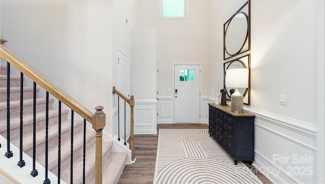 4238 Steel Way, Sherrills Ford, NC 28673 - foyer entrance with dark wood finished floors, wainscoting, stairway, a towering ceiling, and a decorative wall