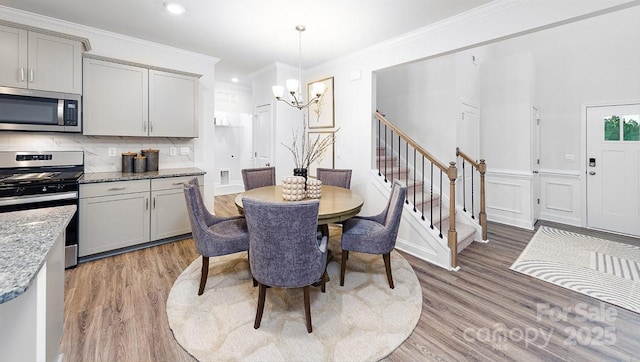 4238 Steel Way, Sherrills Ford, NC 28673 - dining area with a chandelier, light wood-style flooring, stairs, crown molding, and recessed lighting