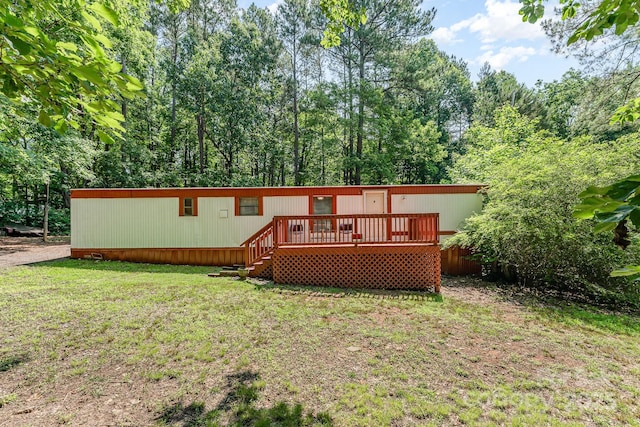 5239 Lineberger Rd, Stanley, NC 28164 - rear view of house featuring a deck and a yard