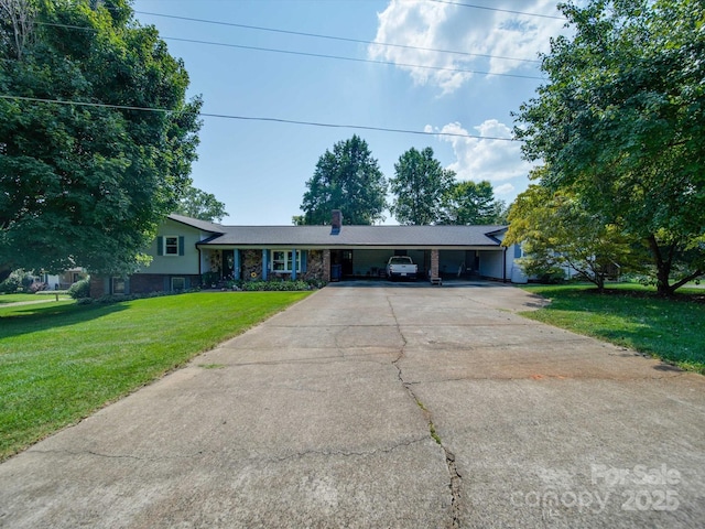 3509 Flint Dr, Statesville, NC 28677 - view of front of house featuring a front lawn, a carport, driveway, and a chimney