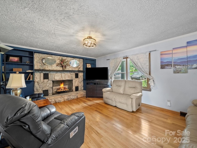 3509 Flint Dr, Statesville, NC 28677 - living room with wood finished floors, a textured ceiling, crown molding, a fireplace, and a chandelier