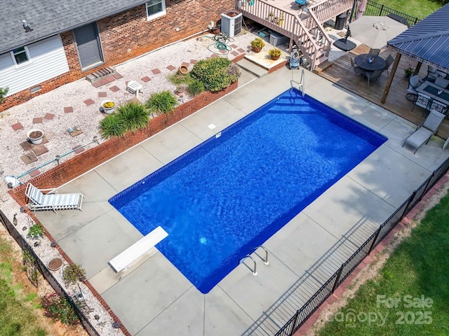 3509 Flint Dr, Statesville, NC 28677 - view of swimming pool featuring a fenced backyard, a deck, a diving board, and a patio area