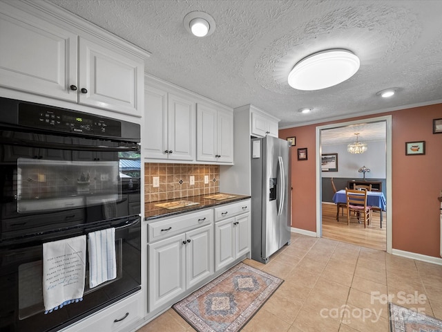 3509 Flint Dr, Statesville, NC 28677 - kitchen featuring stainless steel fridge with ice dispenser, dark countertops, tasteful backsplash, white cabinets, and a chandelier