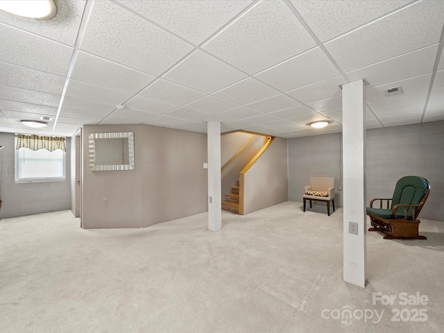 3509 Flint Dr, Statesville, NC 28677 - below grade area featuring a paneled ceiling, concrete block wall, stairs, and carpet floors