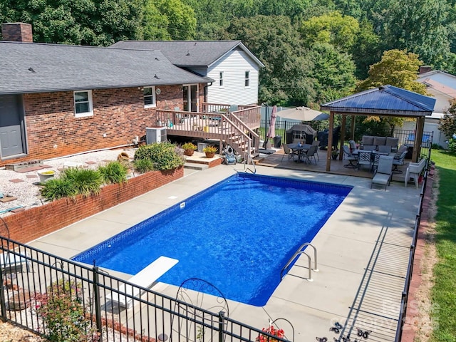 3509 Flint Dr, Statesville, NC 28677 - view of pool featuring outdoor lounge area, a gazebo, a wooden deck, a patio area, and a diving board