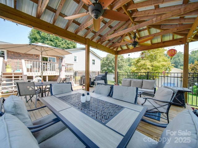 3509 Flint Dr, Statesville, NC 28677 - wooden deck featuring ceiling fan, outdoor dining space, and an outdoor hangout area