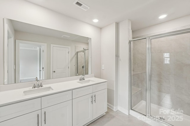 108 Ciara Pl Unit E, Mooresville, NC 28117 - bathroom with double vanity, a stall shower, recessed lighting, and tile patterned floors