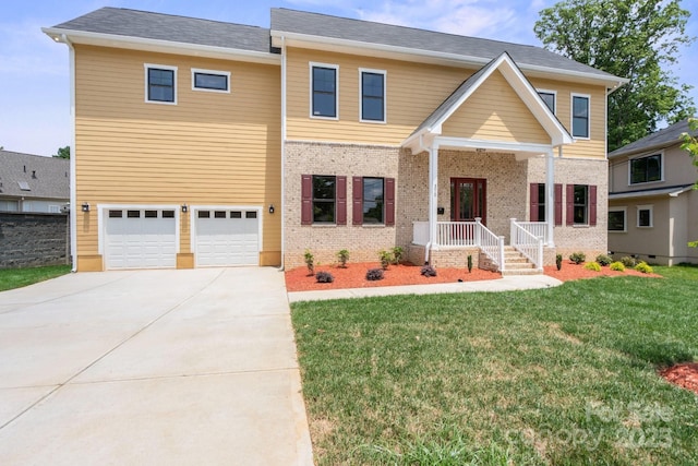 4015 Randolph Rd, Charlotte, NC 28211 - view of front facade with driveway, a front lawn, an attached garage, and brick siding