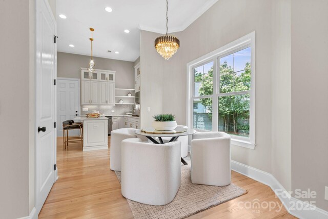 4015 Randolph Rd, Charlotte, NC 28211 - dining space featuring a chandelier, light wood-style flooring, and recessed lighting
