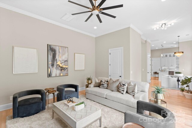 4015 Randolph Rd, Charlotte, NC 28211 - living area with a ceiling fan, crown molding, light wood-type flooring, and recessed lighting