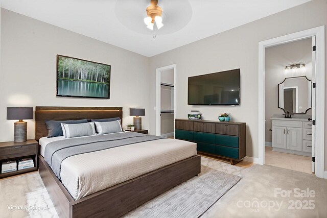 4015 Randolph Rd, Charlotte, NC 28211 - bedroom featuring a walk in closet, a closet, ensuite bathroom, and a ceiling fan