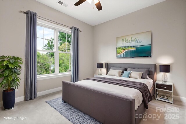 4015 Randolph Rd, Charlotte, NC 28211 - bedroom featuring multiple windows, ceiling fan, and light carpet