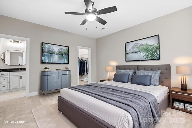 4015 Randolph Rd, Charlotte, NC 28211 - bedroom with a spacious closet, light carpet, connected bathroom, a closet, and ceiling fan