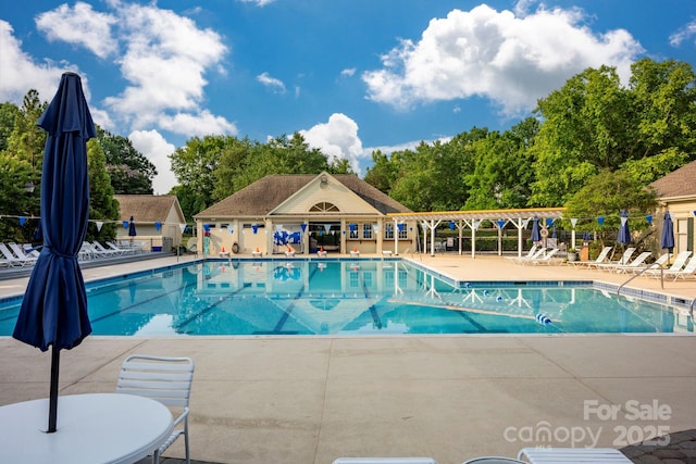8805 Deerland Ct, Huntersville, NC 28078 - community pool featuring a patio area