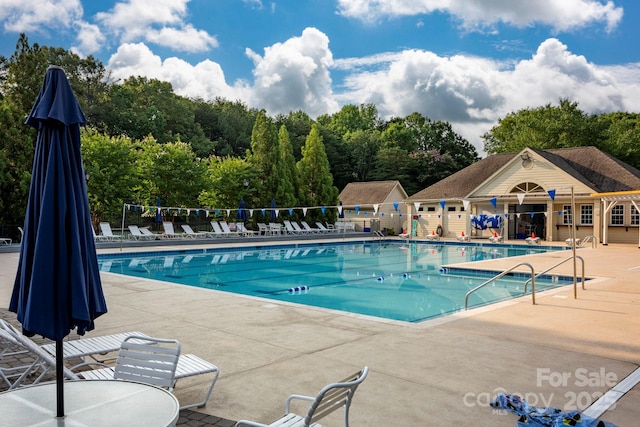 8805 Deerland Ct, Huntersville, NC 28078 - community pool featuring a patio area