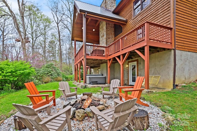 40 Ollis Ridge Ln, Elk Park, NC 28622 - view of patio with a hot tub, an outdoor fire pit, and a wooden deck