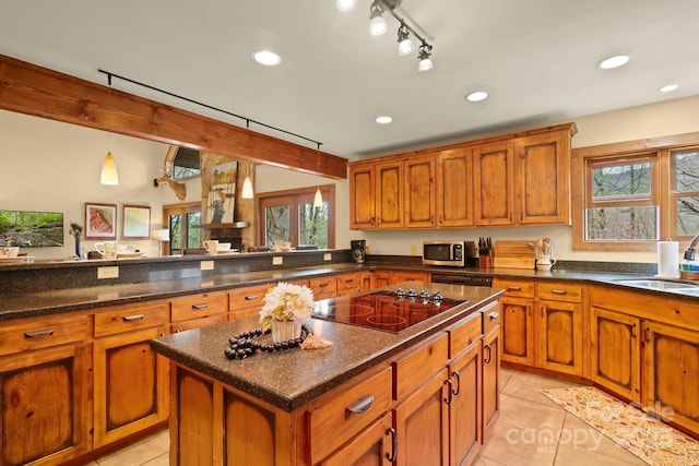 40 Ollis Ridge Ln, Elk Park, NC 28622 - kitchen with black electric cooktop, a sink, stainless steel microwave, brown cabinets, and recessed lighting