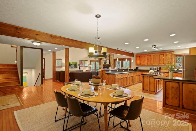 40 Ollis Ridge Ln, Elk Park, NC 28622 - dining space with light wood finished floors, recessed lighting, and stairs