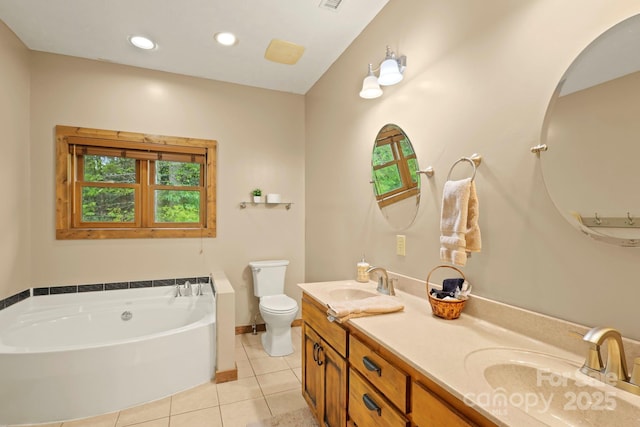 40 Ollis Ridge Ln, Elk Park, NC 28622 - full bath featuring toilet, tile patterned flooring, double vanity, a garden tub, and baseboards