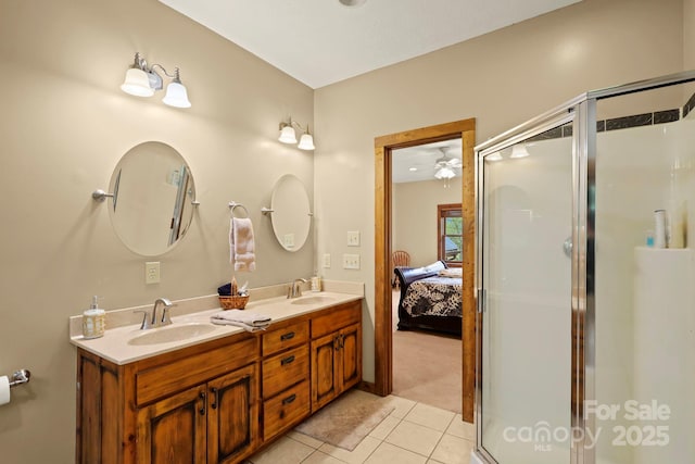 40 Ollis Ridge Ln, Elk Park, NC 28622 - ensuite bathroom with tile patterned floors, double vanity, a shower stall, and a ceiling fan