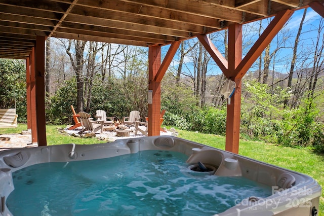 40 Ollis Ridge Ln, Elk Park, NC 28622 - view of patio / terrace featuring a hot tub and an outdoor fire pit