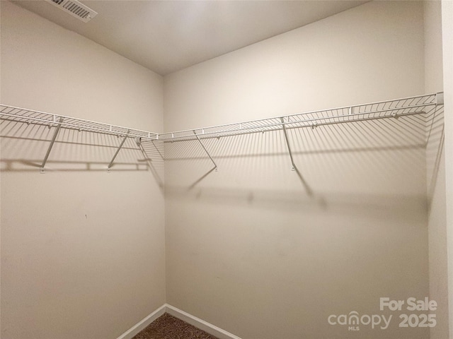 414 1st Ave SE, Hickory, NC 28602 - walk in closet featuring dark carpet