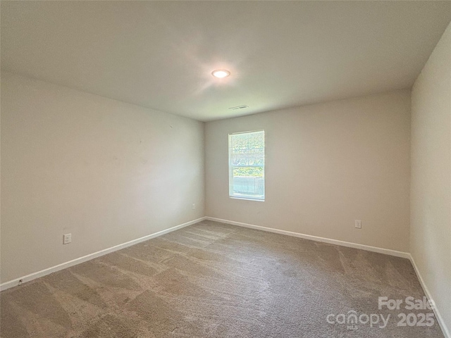 414 1st Ave SE, Hickory, NC 28602 - unfurnished room with carpet floors and baseboards