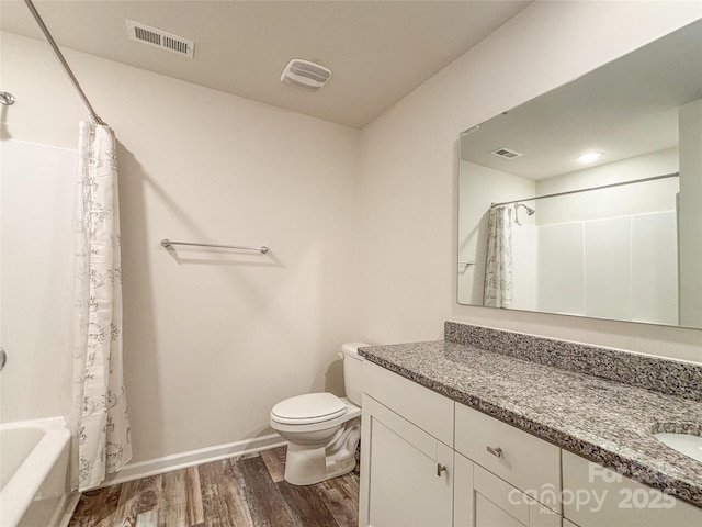 414 1st Ave SE, Hickory, NC 28602 - full bath featuring vanity, wood finished floors, toilet, and shower / tub combo