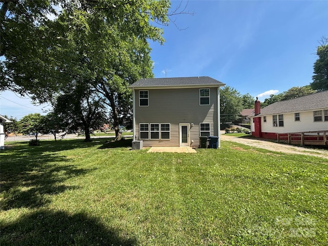 414 1st Ave SE, Hickory, NC 28602 - back of house featuring a yard, a patio area, and central AC
