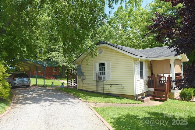 19 Mingus St, Canton, NC 28716 - view of front of house with driveway, a carport, a front lawn, and roof with shingles