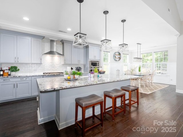 4237 Island Fox Ln, Denver, NC 28037 - kitchen featuring wall chimney exhaust hood, appliances with stainless steel finishes, recessed lighting, gray cabinets, and dark wood-style flooring