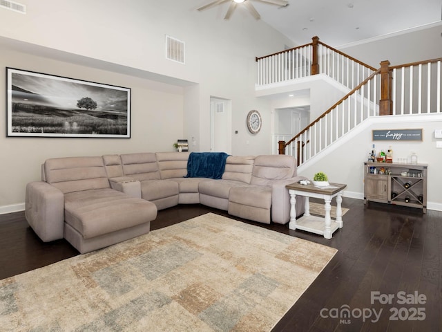 4237 Island Fox Ln, Denver, NC 28037 - living area featuring dark wood finished floors, ceiling fan, stairs, and high vaulted ceiling