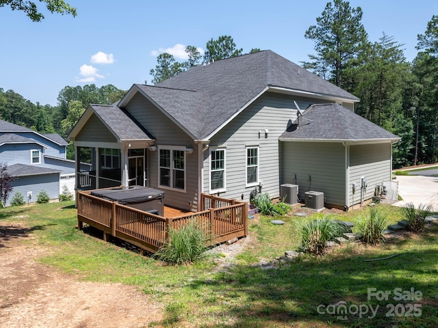 4237 Island Fox Ln, Denver, NC 28037 - back of property with a hot tub, roof with shingles, a wooden deck, and a yard