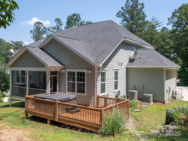4237 Island Fox Ln, Denver, NC 28037 - back of property with a hot tub, roof with shingles, a wooden deck, a sunroom, and a yard