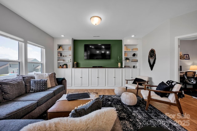 1315 Elizabeth Ave, Kannapolis, NC 28083 - living area with light wood-type flooring and built in features