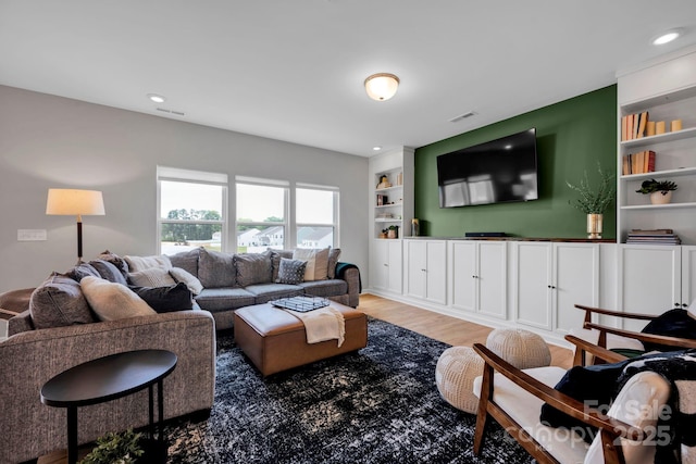 1315 Elizabeth Ave, Kannapolis, NC 28083 - living area with light wood-style floors, built in shelves, and recessed lighting