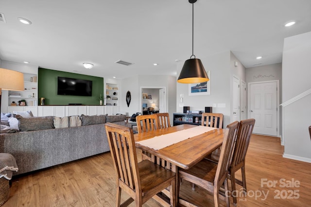 1315 Elizabeth Ave, Kannapolis, NC 28083 - dining space with light wood finished floors, built in features, and recessed lighting