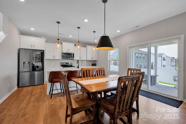 1315 Elizabeth Ave, Kannapolis, NC 28083 - dining space with light wood finished floors and recessed lighting