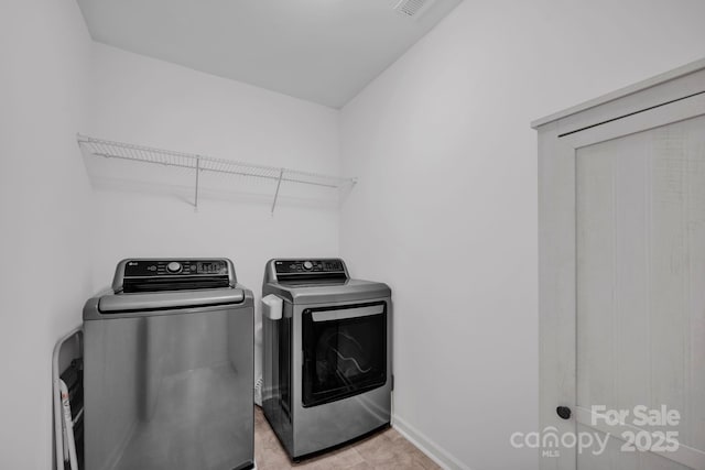 1315 Elizabeth Ave, Kannapolis, NC 28083 - laundry area with independent washer and dryer and baseboards