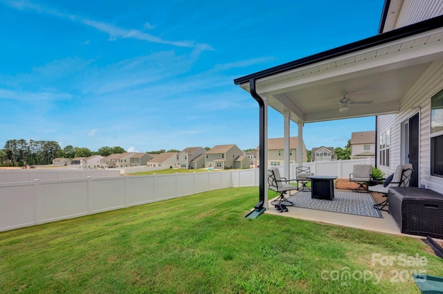 1315 Elizabeth Ave, Kannapolis, NC 28083 - fenced backyard featuring a ceiling fan, a residential view, and a patio area