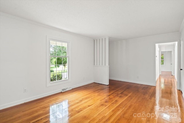 1512 Anthony Dr, Gastonia, NC 28052 - unfurnished room with light wood finished floors, crown molding, and attic access