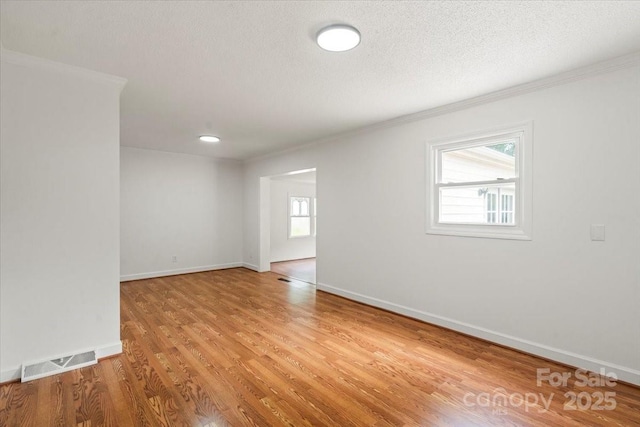 1512 Anthony Dr, Gastonia, NC 28052 - spare room with ornamental molding, light wood-style floors, and a textured ceiling