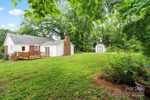 1512 Anthony Dr, Gastonia, NC 28052 - view of grassy yard featuring a storage shed and a wooden deck